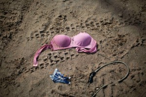 FILE - In this Friday, May 16, 2014 file photo, a discarded bra lies on the ground outside an informal bar that allegedly employed sex workers after a government raid on the illegal mining camp in La Pampa in the Madre de Dios region of Peru. Amnesty International approved a controversial policy Tuesday, Aug. 11, 2015 to endorse the de-criminalization of the sex trade, rejecting complaints by women’s rights groups who say it is tantamount to advocating the legalization of pimping and brothel owning. (AP Photo/Rodrigo Abd, File)