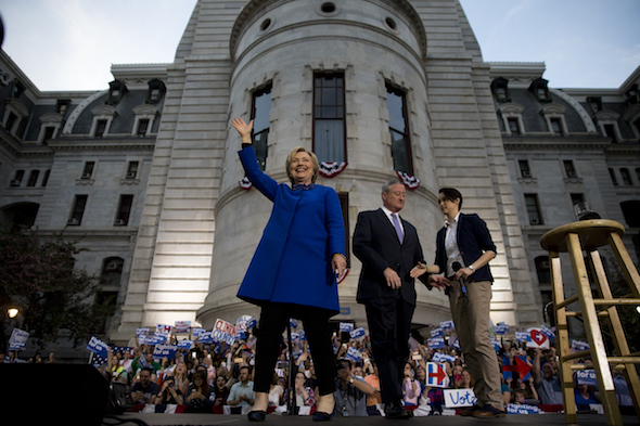 Democratic presidential candidate Hillary Clinton arrives, accompanied by Mayor Jim Kenney for a during a campaign stop, Monday, April 25, 2016, at City Hall in Philadelphia. (AP Photo/Matt Rourke)