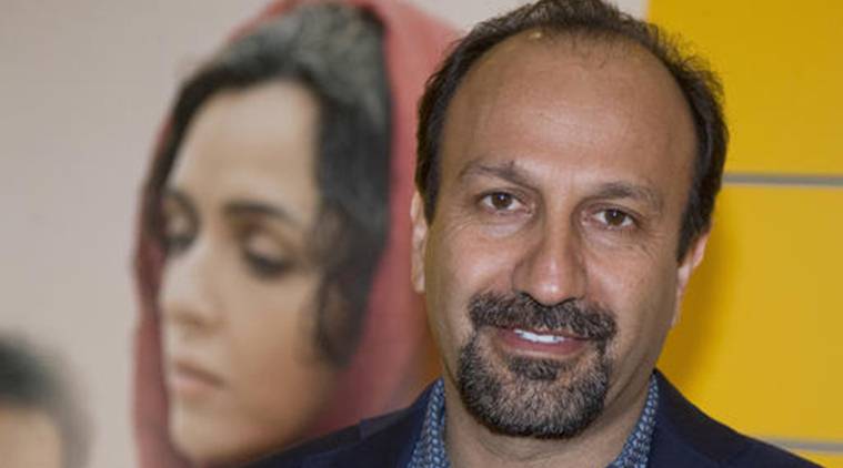 FILE - In this Oct. 10, 2016 file photo, Iranian director Asghar Farhadi poses for a photo during the premiere of his film, "The Salesman, in Paris. The motion picture academy calls "extremely troubling," the possible visa ban of Iranian director Farhadi, whose feature film "The Salesman" is nominated for a best foreign language Oscar. In a statement released Saturday, Jan. 28, 2017, the Academy of Motion Picture Arts and Sciences expressed concern that Farhadi and his cast and crew may not be permitted to attend next month's Oscar ceremony in Los Angeles following President Trump's plan to temporarily suspend issuing visas for people from Iran and six other Muslim countries. (AP Photo/Michel Euler, File)