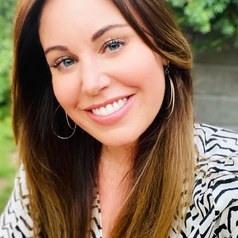 A child uses a spade to break up soil during a gardening exercise with the American Indian Center in Chicago.